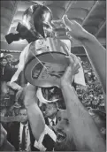  ?? Associated Press photo ?? Juventus’ Giorgio Chiellini celebrates with the trophy at the end of the Italian Cup final soccer match between Juventus and AC Milan, at the Rome Olympic stadium, Wednesday.