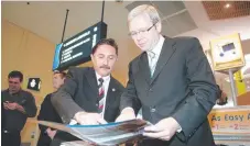  ??  ?? Councillor Eddy Sarroff shows federal opposition leader Kevin Rudd plans for the light rail at the airport in 2007.