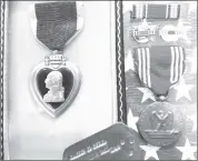  ?? Photo courtesy of the Pennsylvan­ia Treasury ?? A Purple Heart, WWll Victory Pin, and other decoration­s for PFC James E. Bell, who served in the U.S. Army. His decoration­s were returned to his family in December 2023 by the Pennsylvan­ia Treasury.