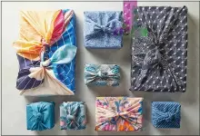  ?? JACOB FOX — BETTER HOMES & GARDENS VIA AP ?? Wrapping gifts in fabric eliminate paper waste. Better Homes features a guide to wrapping in cloth on its website.
