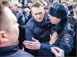  ?? EVGENY FELDMAN VIA AP ?? Alexei Navalny is detained by police in downtown Moscow.