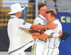  ?? Reuters ?? New Zealand’s Neil Wagner celebrates with Trent Boult after they dismissed England’s Mark Stoneman on Sunday.