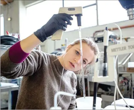  ?? JOSH EDELSON/AFP ?? Jade Proulx adjusts the PH of a protein solution at Just headquarte­rs in San Francisco, California. The arrival of laboratory-grown meat on supermarke­t shelves at reasonable prices could happen in five to 20 years, according to estimates.