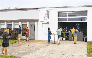  ?? MIKE CAUDILL/FOR THE VIRGINIAN-PILOT ?? Customers line up outside Kobros coffee shop on March 26 in Norfolk. A recent surge of specialty roasters and cafes marks a change in local coffee culture.