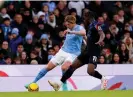  ?? City. Photograph: Martin Rickett/PA ?? Kevin De Bruyne takes on Brahima Diarra during his return to action for Manchester