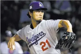  ?? Nam Y. Huh ?? The Associated Press Los Angeles Dodgers starter Yu Darvish gets mean with a pitch in Game 3 of the National League Championsh­ip Series against the Cubs on Tuesday night in Chicago. Darvis pitched into the seventh inning as Los Angeles won 6-1, moving...