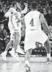  ?? Allison Lee Isley / Associated Press ?? HBU’s Braxton Bonds, left, and Ian DuBose, right, celebrate after finishing their upset of Wake Forest.