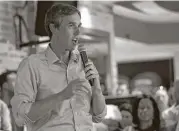  ?? Karen Warren / Houston Chronicle ?? Houston resident Gaby Diaz, left, questions Sen. Ted Cruz and Dan Caldwell, director of policy for Concerned Veterans of America, on Saturday. U.S. Rep. Beto O’Rourke, right, is challengin­g Cruz for his Senate seat.