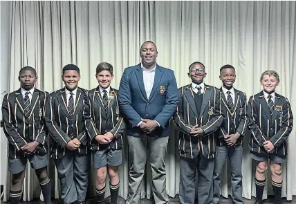  ?? Picture: SUPPLIED ?? GO BOYS: Queen’s College was well represente­d in the U12 Coastal Rugby Tournament in Riversdale with, from left, Liyema Mnqibisa, Syon Mata, Charles Broster, assistant coach Lungi Dube, Anayolo Tobeka, Samkelo Guma and Stef Van Biljon