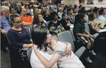  ?? Francine Orr Los Angeles Times ?? PERLA ESPARZA of Los Angeles and son Joshua Del Campo attend a Los Angeles school board meeting Tuesday on how to fill the vacancy created by the resignatio­n of board member Ref Rodriguez last month.