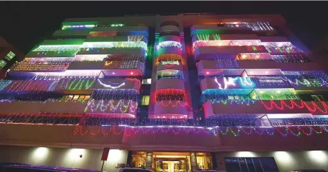  ?? Arshad Ali/Gulf News ?? Decorative lighting adorns balconies of a building in Bur Dubai’s Mankhool area where Indian expats live in large numbers.