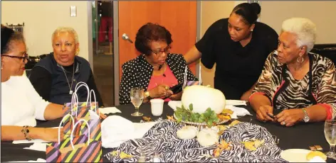  ?? Janice McIntyre/News-Times ?? Ladies at table: Members of The Traveling Friends discuss Christmas plans during the group’s regular monthly meeting in the El Dorado Conference Center. Pat Collins, second from left, is the daughter of Lois Meekins, the only member of Traveling...