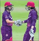  ??  ?? Sarah and Kathryn celebrate a 50 partnershi­p for Loughborou­gh Lightning against Lancashire Thunder back in August