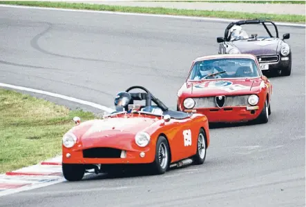  ??  ?? A rare Turner Climax leads an Alfa and MG Midget at a recent MG Classic.