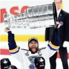  ?? BRIAN FLUHARTY/USA TODAY SPORTS ?? Blues defenseman Alex Pietrangel­o lifts the Stanley Cup after Game 7 against the Bruins in 2019.