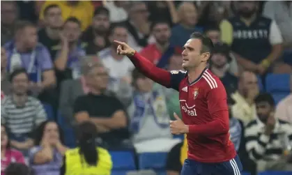  ?? ?? Osasuna's Kike Garcia celebrates after scoring the equaliser at Real Madrid Photograph: Manu Fernández/AP