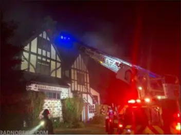  ?? SUBMITTED PHOTO ?? Firefighte­rs attack a house fire in Radnor early Saturday.