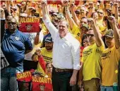  ?? Brett Coomer/Staff file photo ?? Marty Lancton, head of the Houston Profession­al Fire Fighters Associatio­n, marches in 2019 with union members at City Hall over the labor dispute related to the voter-approved Propositio­n B. The Supreme Court heard pay-parity arguments in November.