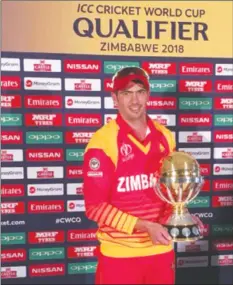  ?? - ICC ?? KEEP IT HOME SON . . . Zimbabwe captain Graeme Cremer holds the ICC Cricket World Cup trophy at Queens Sports Club yesterday.