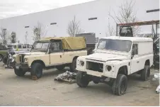  ?? ?? Original Land Rovers await their turn for an ECD transforma­tion.