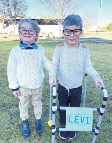  ??  ?? ■ St Michael’s students Bertie Landale and Levi De Silva all dressed up.