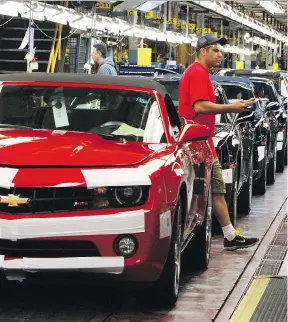  ?? VERONICA HENRI ?? Chevrolet Camaro vehicles are shown at the assembly plant in Oshawa, Ont., in this 2011 photo. The incoming Trump administra­tion’s expected protection­ist trade policies may hit auto companies hard in Ontario, considerin­g the muscle of the industry.