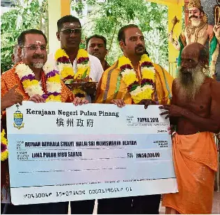 Handing out aid - PressReader