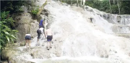  ?? FILE ?? Tourists enjoy the world-famous Dunn’s River Falls in Ocho Rios, St Ann.