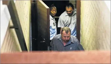  ?? Picture: MOELETSI MABE ?? STAYING IN CUSTODY: Theo Jackson, front, and Willem Oosthuizen at the Middelburg Magistrate’s Court in Mpumalanga yesterday