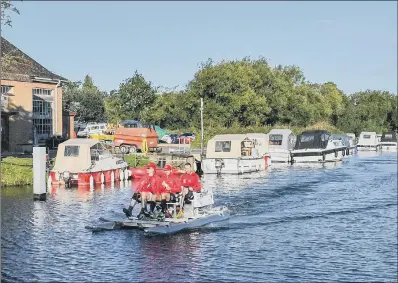  ?? PICTURE: PA ?? ON THEIR WAY: The Challengin­g MND team pedal along the Thames at the start of their attempt to break a Guinness World Record.