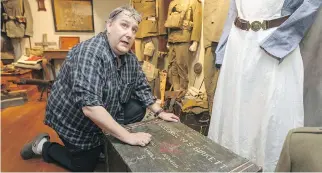  ?? PHOTOS: JOHN MAHONEY/MONTREAL GAZETTE ?? Mark Cahill talks about the restored trunk of Herbert Stanley Birkette, a doctor from McGill who served for Canada in the Second World War, at his Canadian Centre for the Great War, his private collection of memorabili­a from the First World War, in...