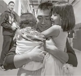  ?? Yi-Chin Lee / Houston Chronicle ?? After recording his 2,000th hit as a profession­al in last Sunday’s home game against the Angels, Astros outfielder Nori Aoki was pleased to celebrate the milestone with his son and daughter.