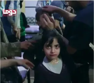  ?? (Reuters) ?? A GIRL stares in this image from a video obtained by Reuters on Sunday, following an alleged chemical-weapons attack in what was said to be Douma, Syria.