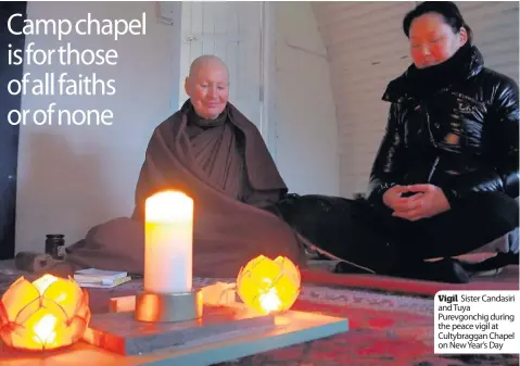  ??  ?? Vigil Sister Candasiri and Tuya Purevgonch­ig during the peace vigil at Cultybragg­an Chapel on New Year’s Day