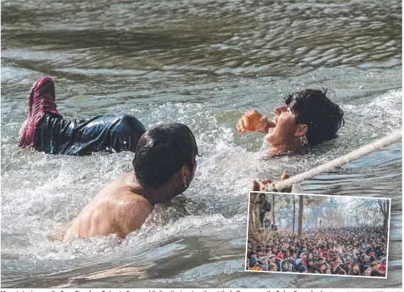  ?? Pictures: BURAK KARA/GETTY IMAGES ?? Migrants try to cross the Evros River from Turkey to Greece, while (inset) migrants gather at the buffer zone on the Turkey-Greece border.