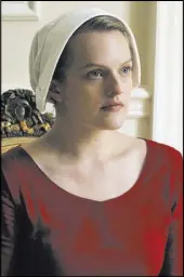  ?? George Kraychyk Hulu ?? Elisabeth Moss is nominated for an Emmy for actress in a drama series for her role in “The Handmaid’s Tale.”