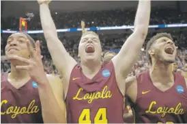  ?? DAVID GOLDMAN/ AP ?? Loyola players celebrate their Elite Eight win on March 24 in Atlanta.