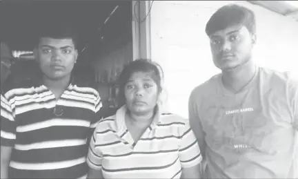  ??  ?? In photo are Ramdial’s two sons Lahkram (left) and Navin and his wife Chaitrani.