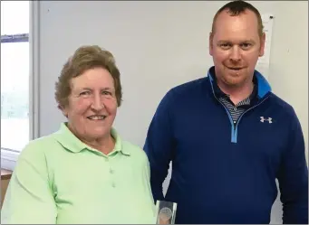  ??  ?? MacBride Club Matchplay Ladies grade winner Anne Fagan receives her prize from club competitio­n secretary Barry Thornton.