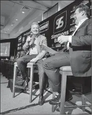  ?? Arkansas Democrat-Gazette/STATON BREIDENTHA­L ?? Former Arkansas Razorback head football coach Bobby Petrino (left) talks with Little Rock Touchdown Club founder David Bazzel on Monday during his appearance at the Little Rock Touchdown Club.