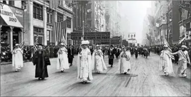  ?? AP PHOTO ?? Dr. Anna Shaw and Carrie Chapman Catt, founder of the League of Women Voters, lead an estimated 20,000support­ers in a women’s suffrage march on New York’s Fifth Ave. in 1915.