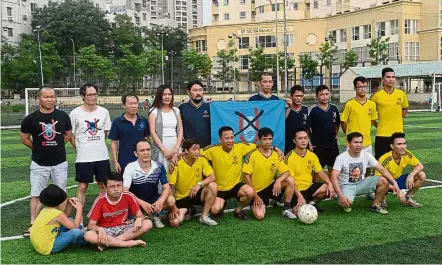  ?? — AFP ?? Playing for democracy: Members of the No-U FC squad posing for a photo before a game at a local pitch in Hanoi.