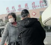  ?? Picture: NOEL CELIS/AFP ?? MEDICAL WATCH: A woman leaves the Wuhan Medical Treatment Centre last weekend where a man who died of a respirator­y illness believed to be caused by a virus from the same family as SARS was confined.