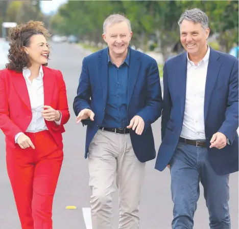  ?? Picture: Mike Dugdale ?? Federal Opposition Leader Anthony Albanese (centre) enjoys a laugh with local Labor MPs Libby Coker and Richard Marles in Armstrong Creek on Saturday.