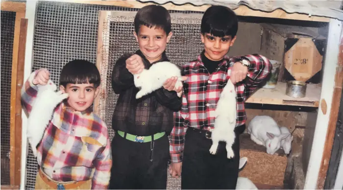  ?? Photos Wissam Tanios ?? Khawam brothers Milad, left, and Jamil, middle, with Wissam Tanios. The three boys were inseparabl­e as children