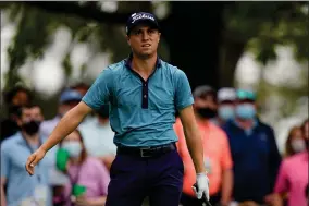  ?? AP PHOTO BY MATT SLOCUM ?? Justin Thomas reacts after his tee shot on the fourth hole during the second round of the Masters golf tournament on Friday, April 9, 2021, in Augusta, Ga.