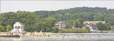  ?? H John Voorhees III / Hearst Connecticu­t Media file photo ?? Swimmers enjoy the cool waters of Candlewood Lake at Danbury Town Park in Danbury last year.