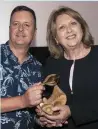  ??  ?? Filmmaker John Butler presents Mary McAleese with the Vanguard Award from Gaze LGBT Film Festival in Dublin last night