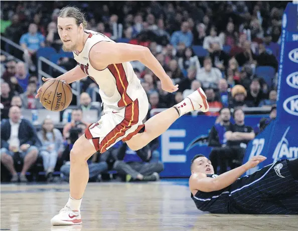  ?? — THE CANADIAN PRESS FILES ?? Miami Heat centre Kelly Olynyk, left, is among the 18 Canadians invited to join the men’s national team for a pair of warm-up games against China in B.C. and the next round of World Cup qualifying games this summer in Toronto and Ottawa.