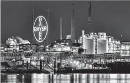 ?? SASCHA STEINBACH/EPA ?? Bayer acquired Monsanto, the maker of Roundup weedkiller, in June for $63 billion.